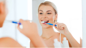 photo of girl brushing her teeth